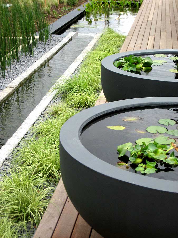 Water rill and freestanding water bowls. Rae Wilkinson Garden and Landscape Design - Garden Designer Sussex, Surrey, London, South-East England